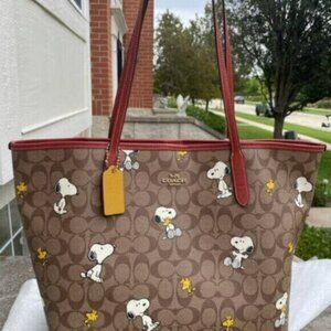 Coach X Peanuts City Tote In Signature Canvas With Snoopy Woodstock Print